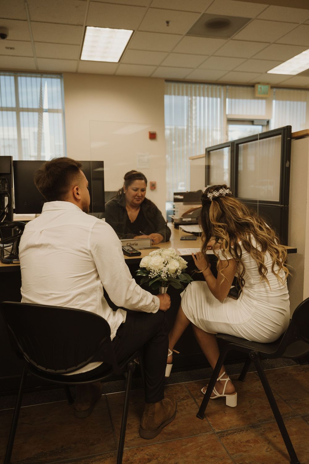 A playful photo sequence in an office with two people dipping in front of cubicles.