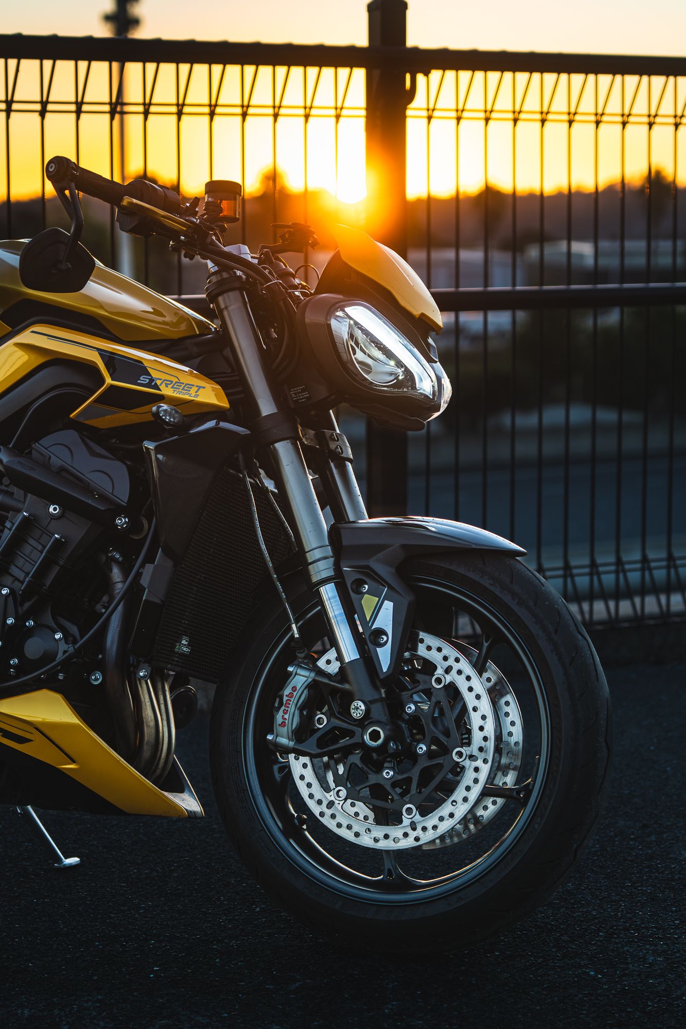 Sunset golden hour shot of a yellow motorcycle