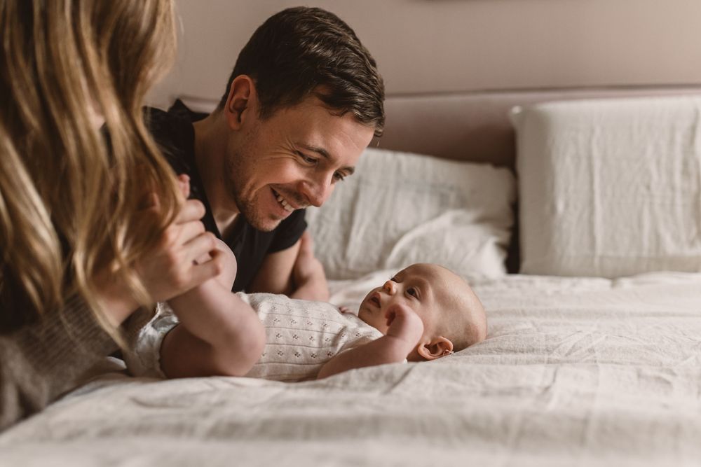 13-week-old baby boy and his parents at an in-home newborn session in London.