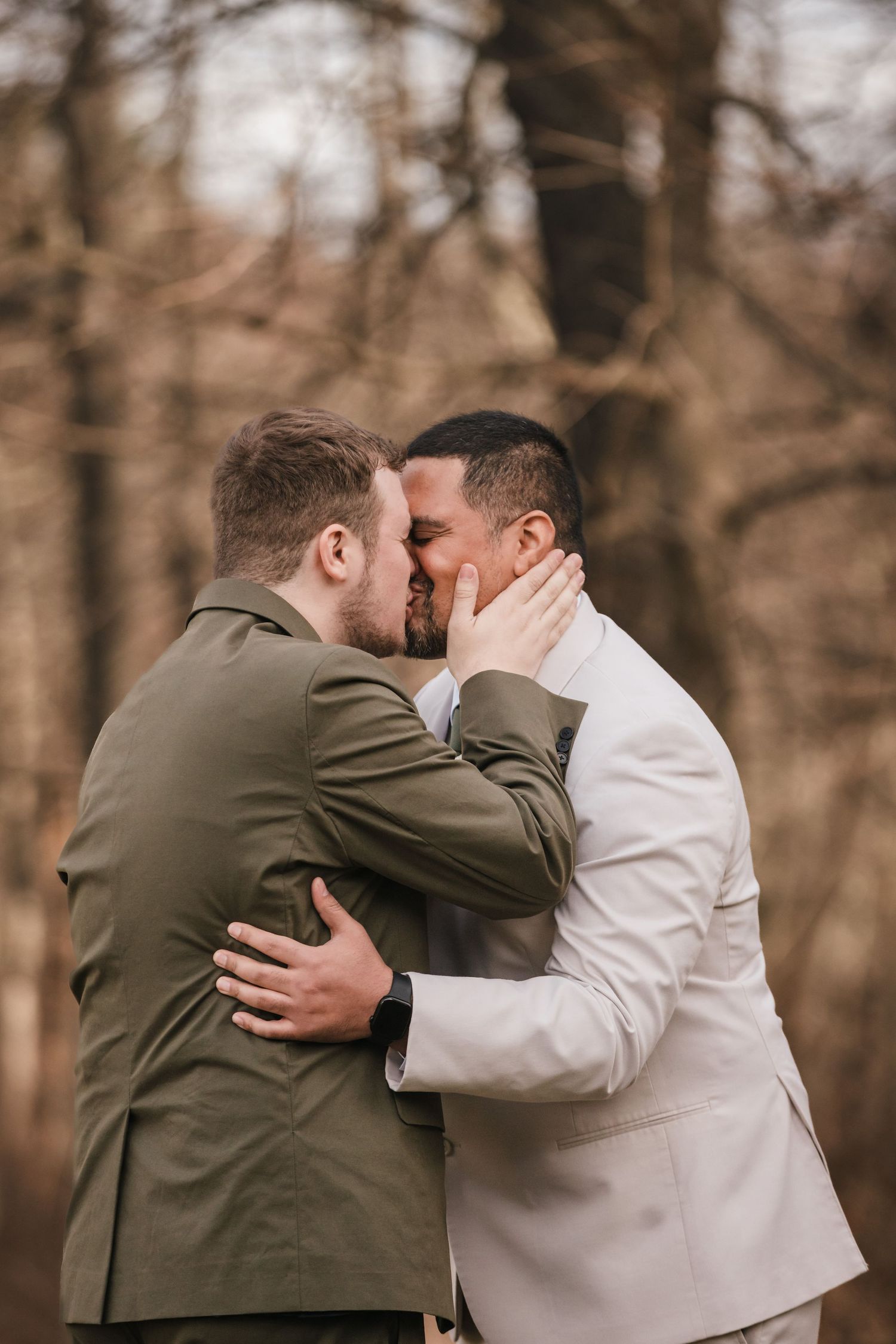 Grooms sharing emotional first kiss during first look at Briar Barn Inn Massachusetts wedding
