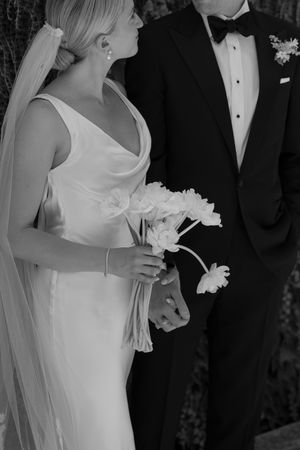A series of black and white wedding ceremony photos showing intimate moments between a bride and groom.