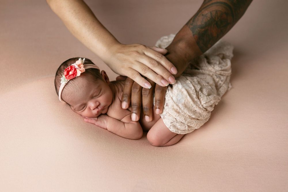 Gentle hands cradle a sleeping newborn, Orlando Newborn Photography, Sanford Newborn Photography, Newborn Photos, Newborn Photo Studio