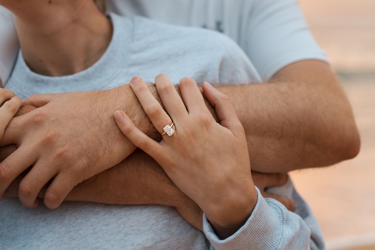 A close-up photo showing hands with engagement ring taken during a secret proposal photoshoot in the northern beaches Newport Beach Sydney