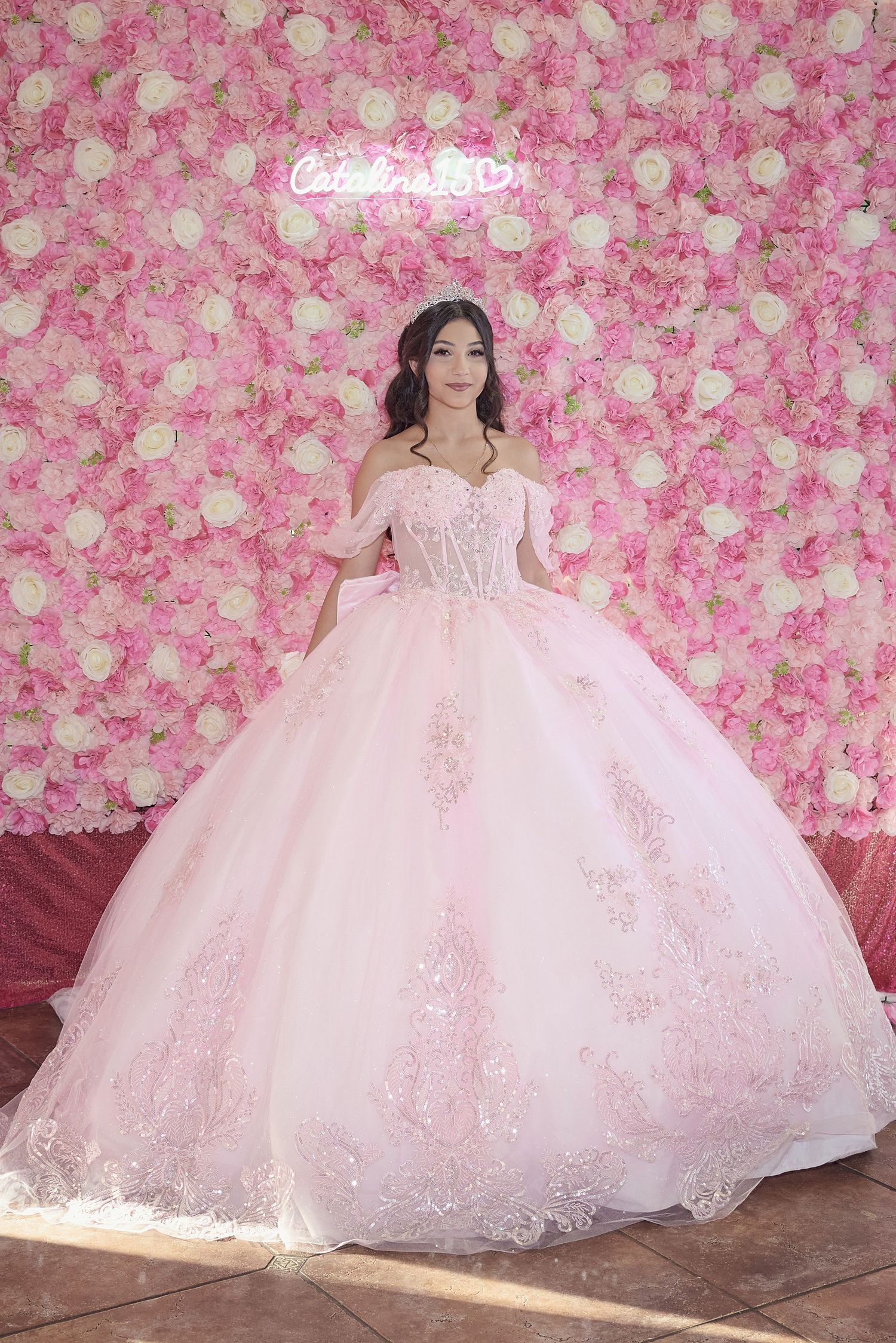 A bride in a flowing white wedding gown twirls gracefully in a grand ballroom setting.