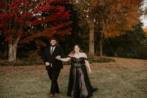 A romantic dance sequence captured against a backdrop of vibrant fall foliage.