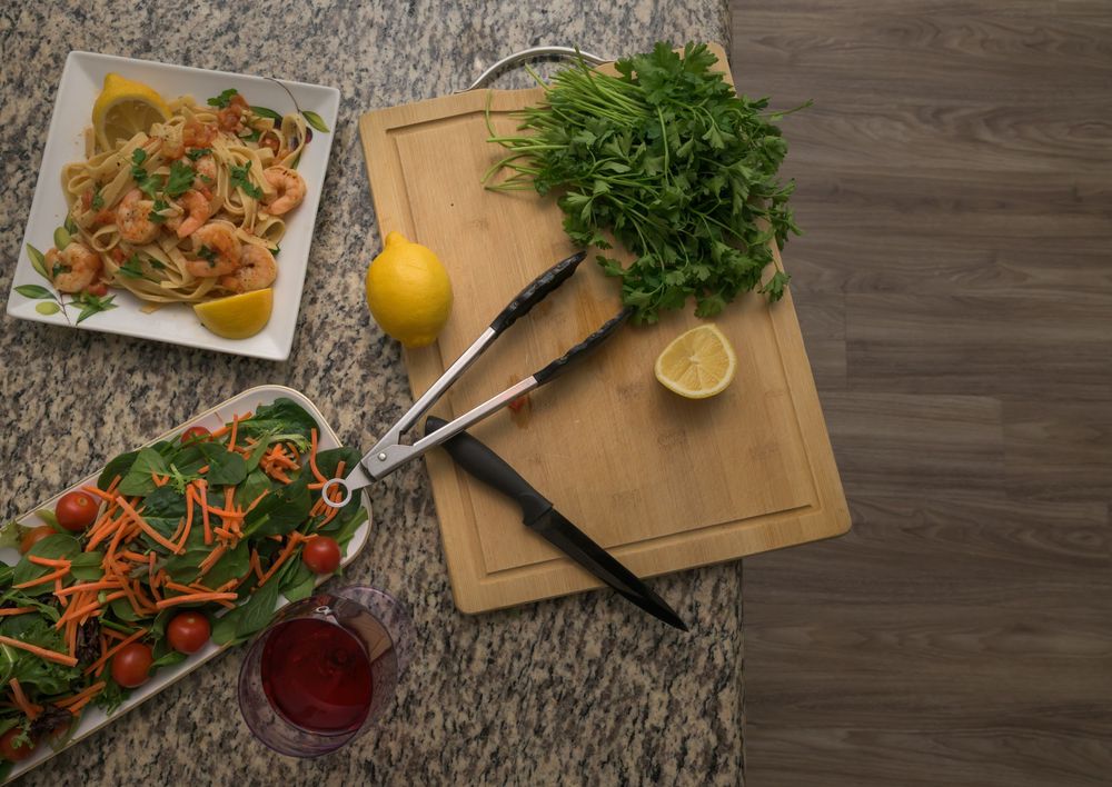 A collection of food preparation images showing fresh ingredients and garnishes on wooden cutting boards.