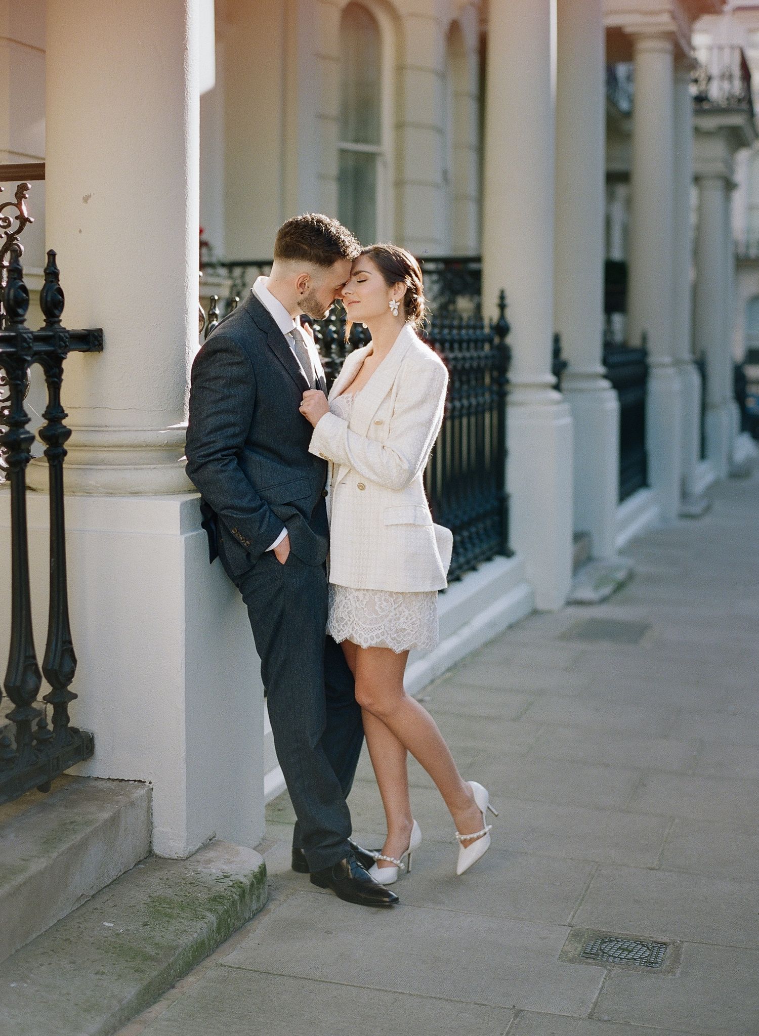 Stylish wedding photography session along a classic London colonnade.