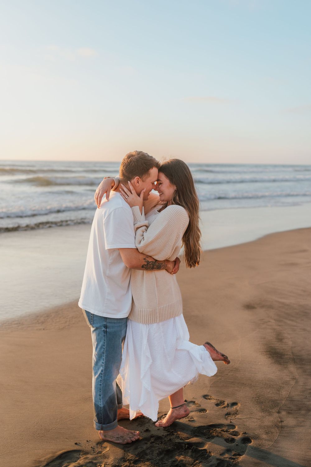 Blacks Beach couples photos with candid movement and dramatic coastal views, San Diego Engagement Photos