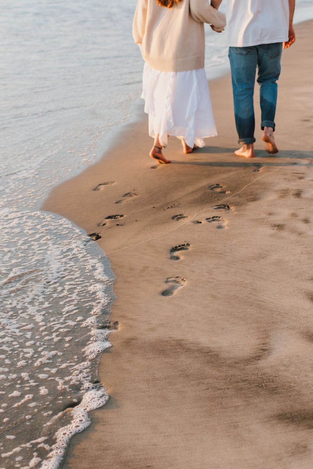 Blacks Beach couples photos with candid movement and dramatic coastal views, San Diego Engagement Photos