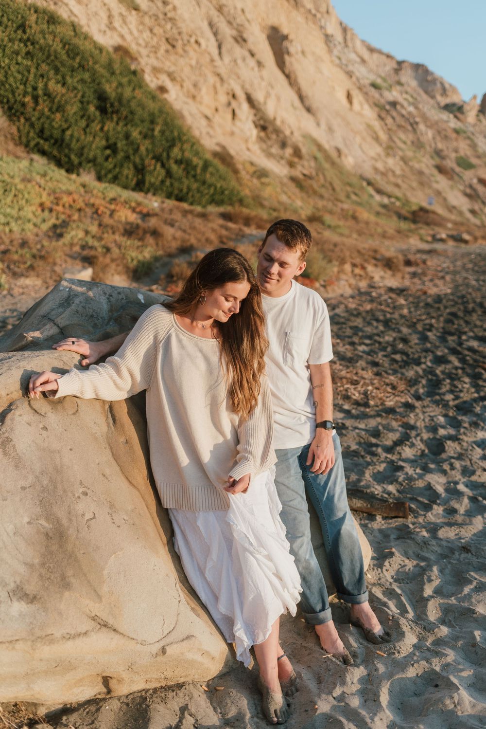 Blacks Beach couples photos with candid movement and dramatic coastal views, San Diego Engagement Photos