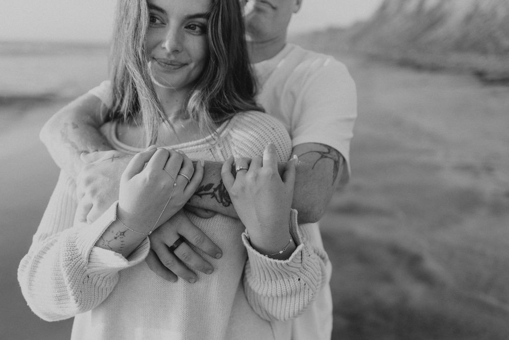 Blacks Beach couples photos with candid movement and dramatic coastal views, San Diego Engagement Photos