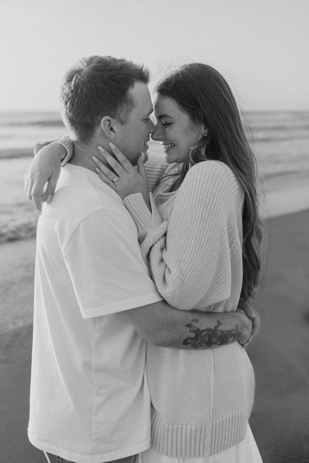 Blacks Beach couples photos with candid movement and dramatic coastal views, San Diego Engagement Photos