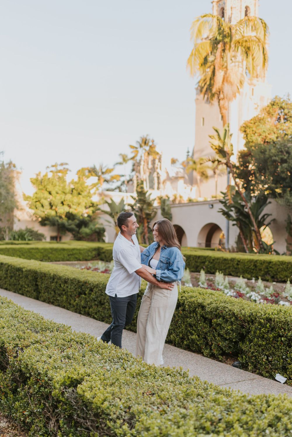 San Diego engagement photos at Balboa Park featuring candid moments and relaxed posing. Romantic and candid engagement session Balboa Park