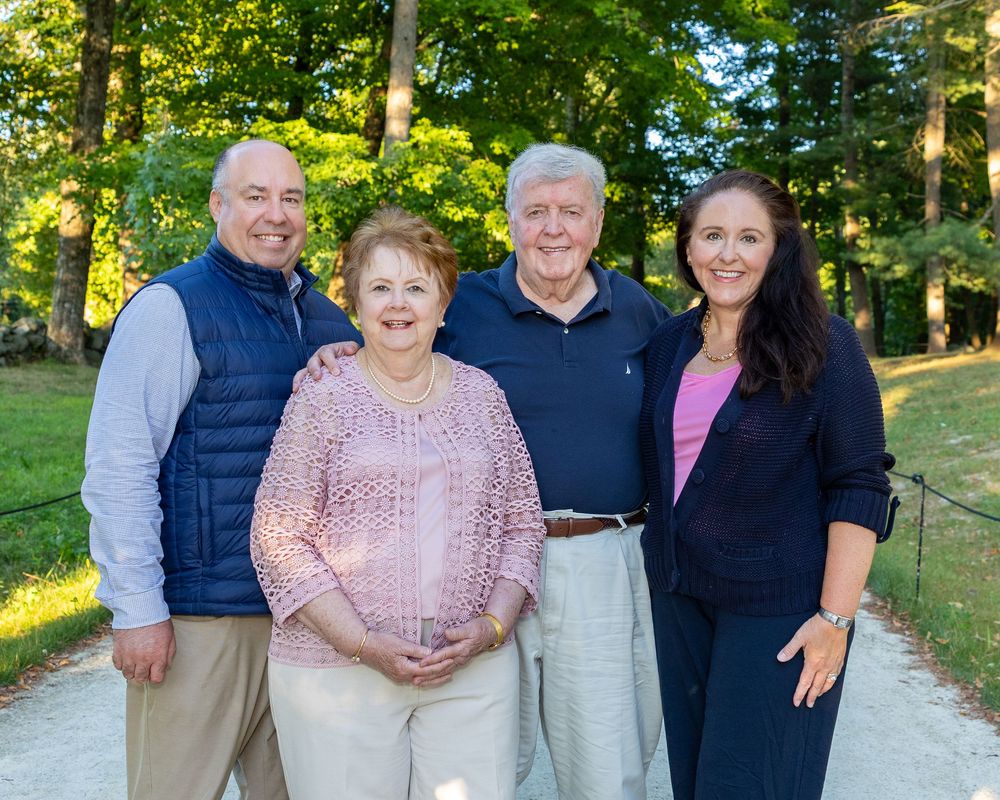 Parents and their adult children during a multi-generation family photo shoot in the Metrowest area of Boston by Lisa West Photography.