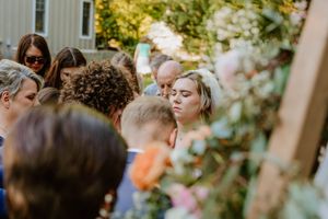Close-up view of wedding guests during an outdoor ceremony.