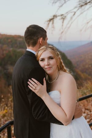 Intimate wedding portraits captured at sunset with mountain vistas in the background.