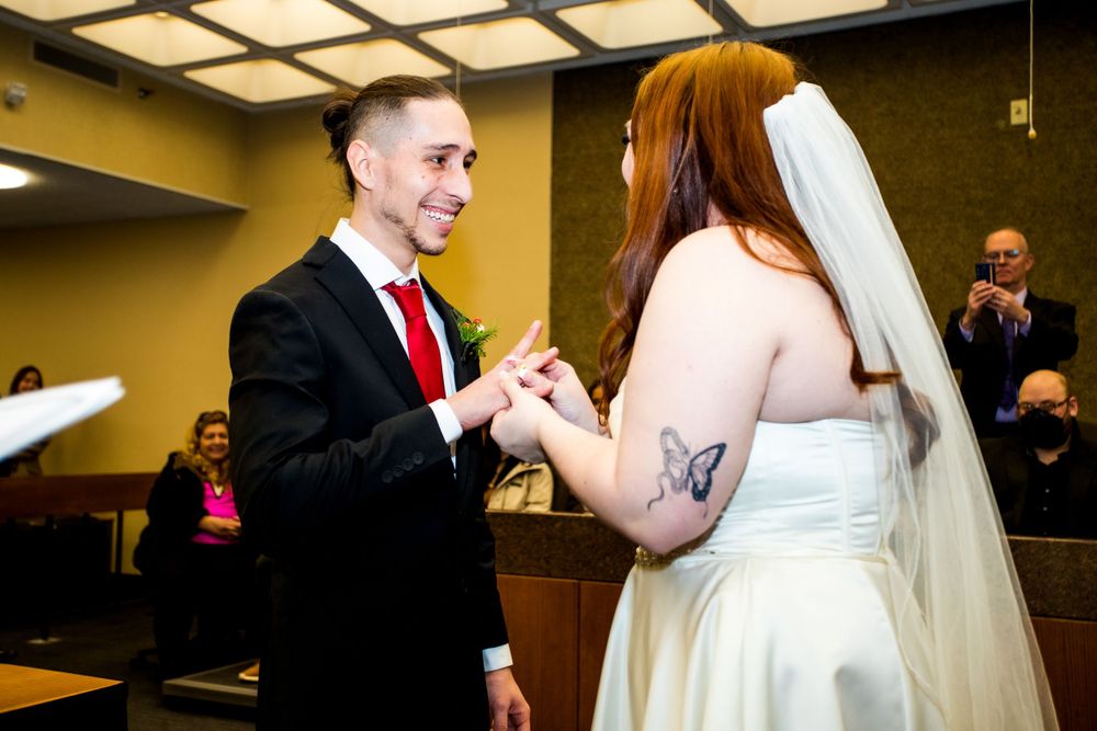 Exchange of rings during wedding ceremony in an official building.