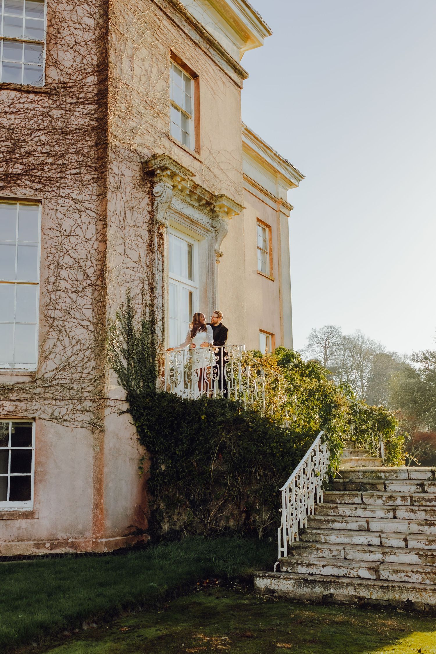 Winter engagement couple photographed on the historic stairs at Hale Park, Hampshire, natural and romantic couple photography