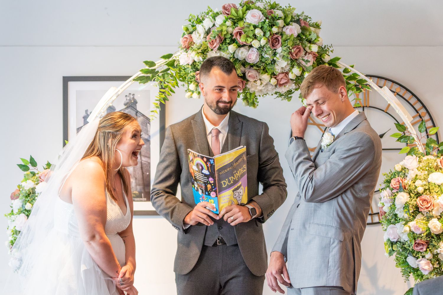 North Wales Wedding Photographer. A couple in fits of laughter during their vows on their wedding day.