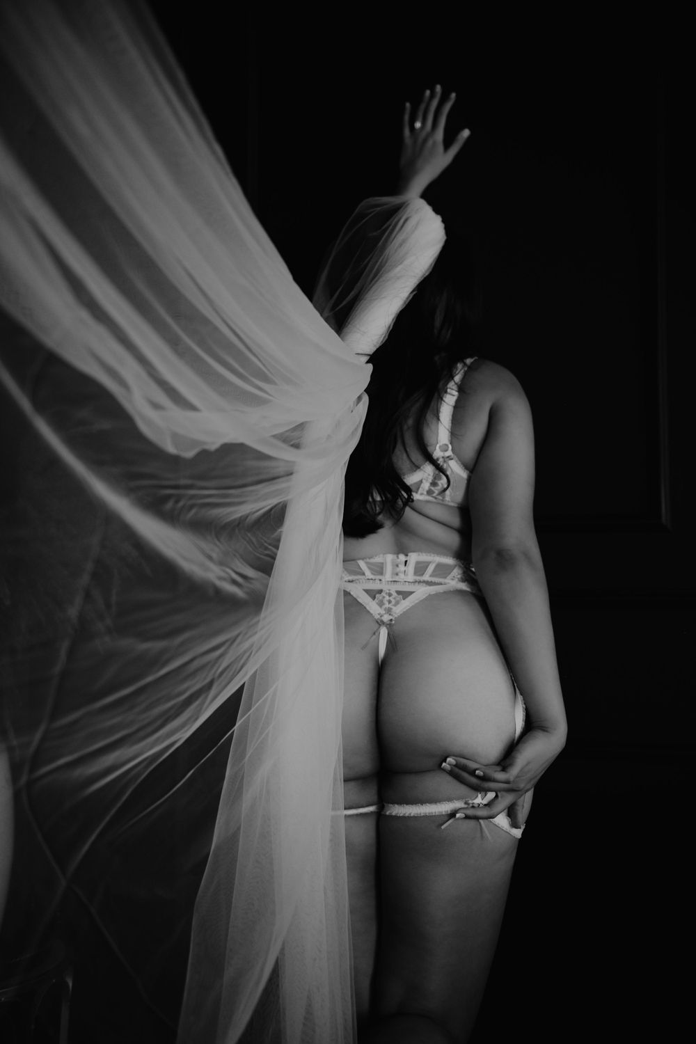 Bridal Photoshoot of Woman embracing self-love during her Sweet Confidence Boudoir photo session.