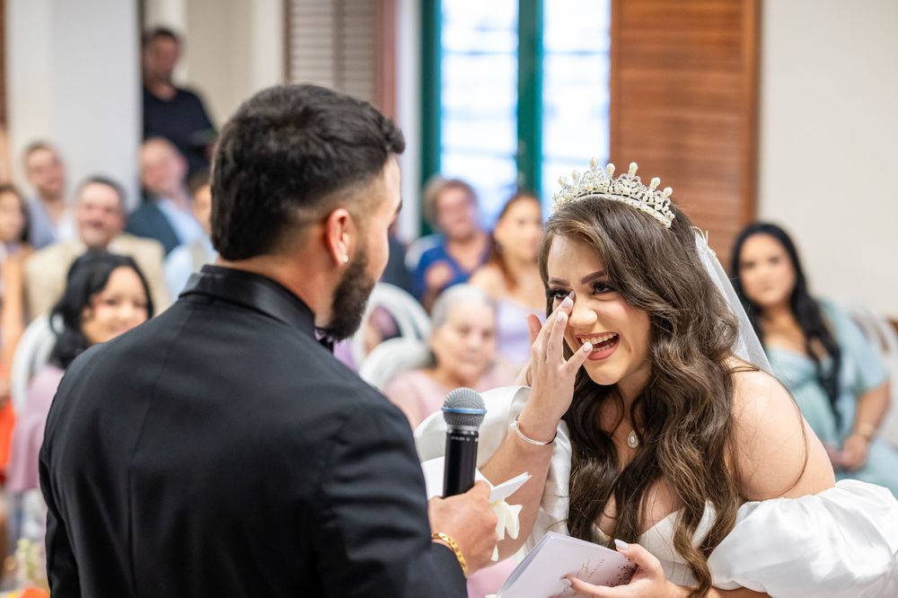 A romantic wedding ceremony moment as the couple exchanges vows in front of guests.