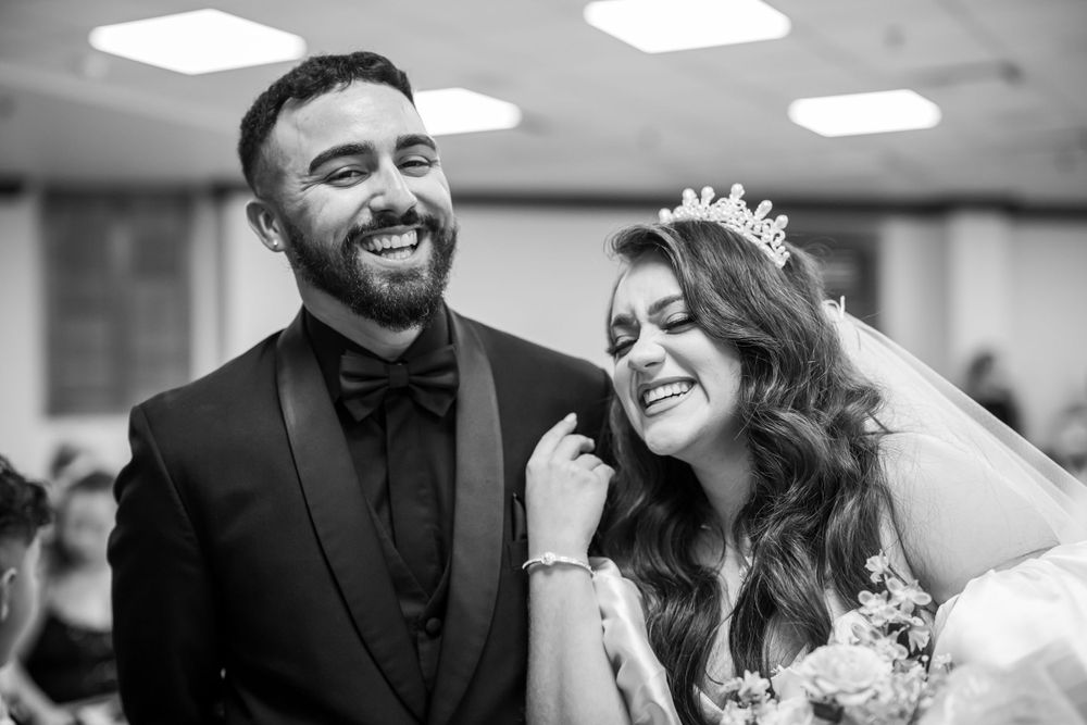 A joyful candid moment captured during a wedding ceremony.
