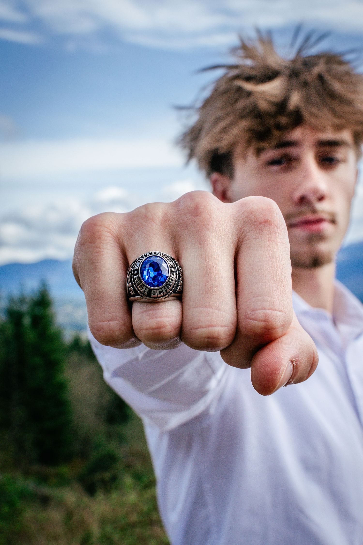 Seattle high school senior graduation portrait of class ring at Snoqualmie Point Park.