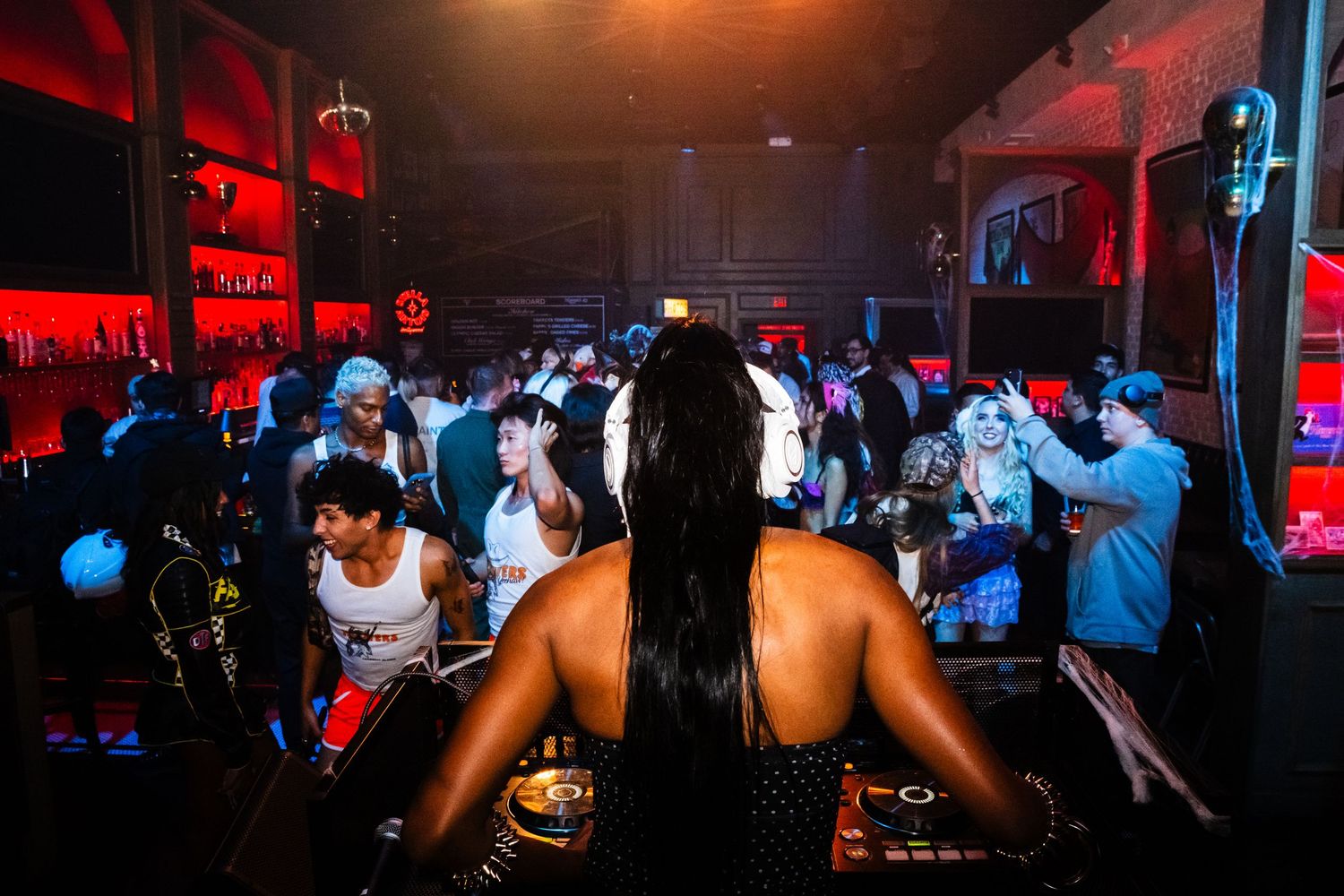 Event photo of Arielle Wilson (Zazja Arielle) performing a dj set in front of a crowd at Haus of Muah at the Palm and pine in LA