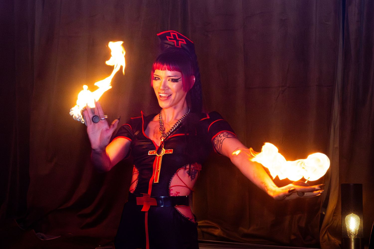 Photo of Versace glitch firebending a the Haus of Muah event at the palm and pine in LA.