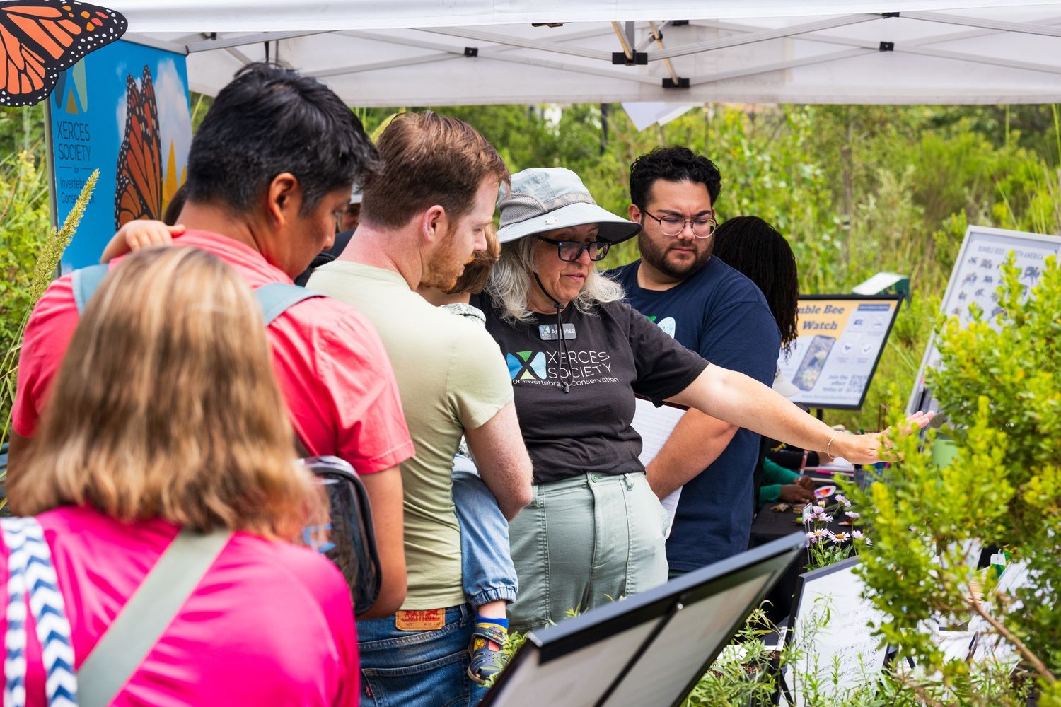 A volunteer with Friends of Ballona explains the importance of bees in the local ecosystem to attendees at their Migration event.