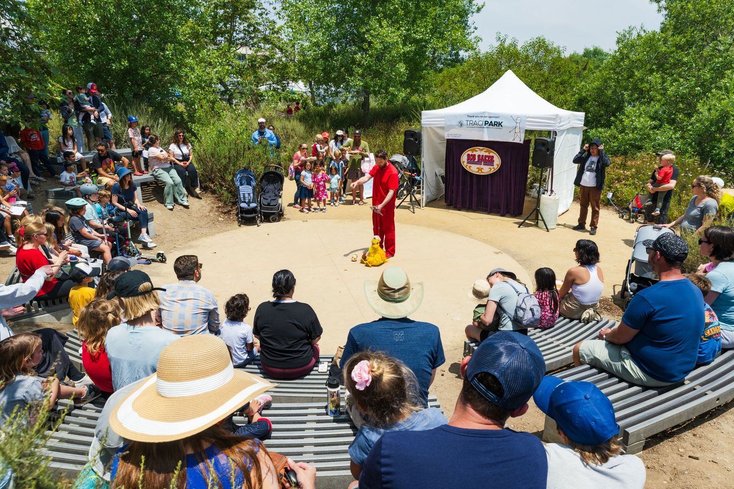 A photo of Bob Baker doing his marionette show at an amphitheater in LA for the Friends of Ballona Migration Event.