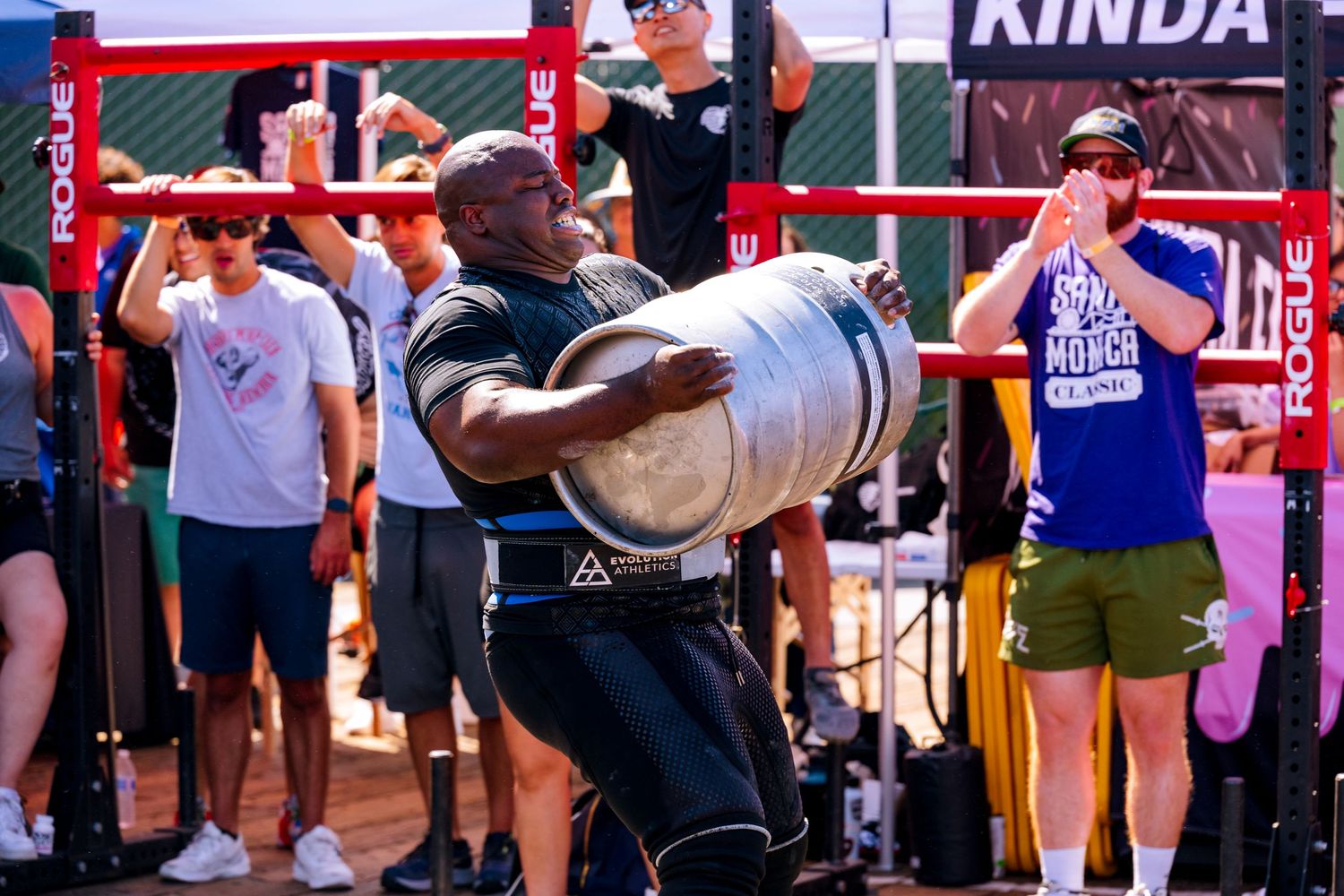 A photo of Ajuna Rwakatare doing the keg carry at Santa Monica's Strongest competition.