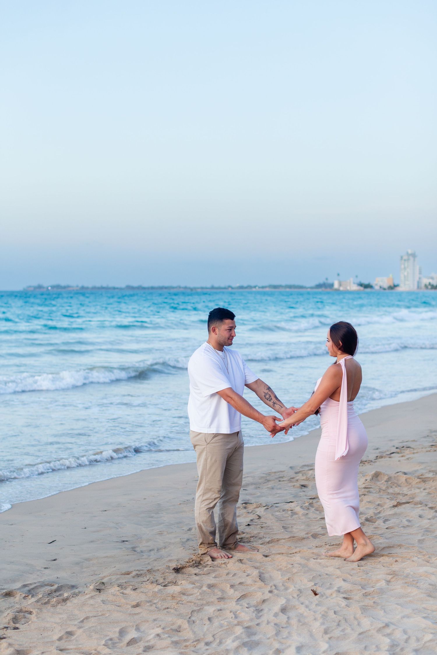 Couples portrait at the beach in Isla Verde, Carolina, Puerto Rico.