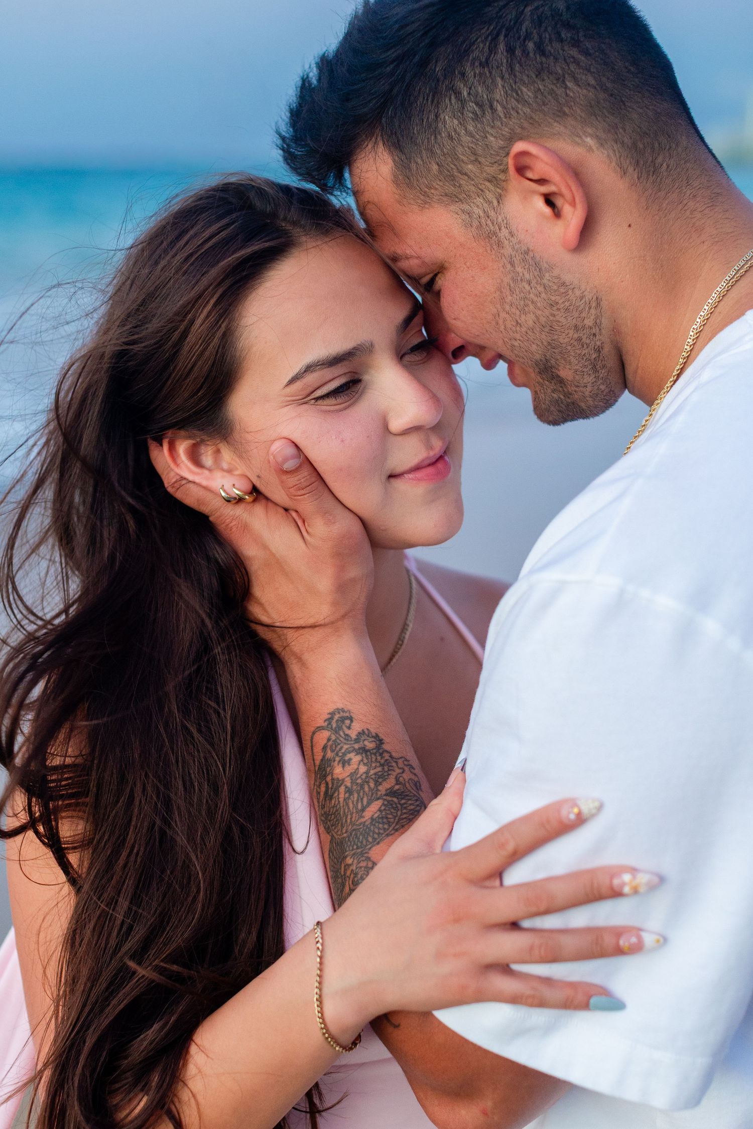 Couples close-up portrait at the beach in Isla Verde, Carolina, Puerto Rico.