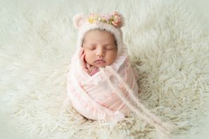 Newborn photography Melbourne, baby in pink outfit studio photoshoot
