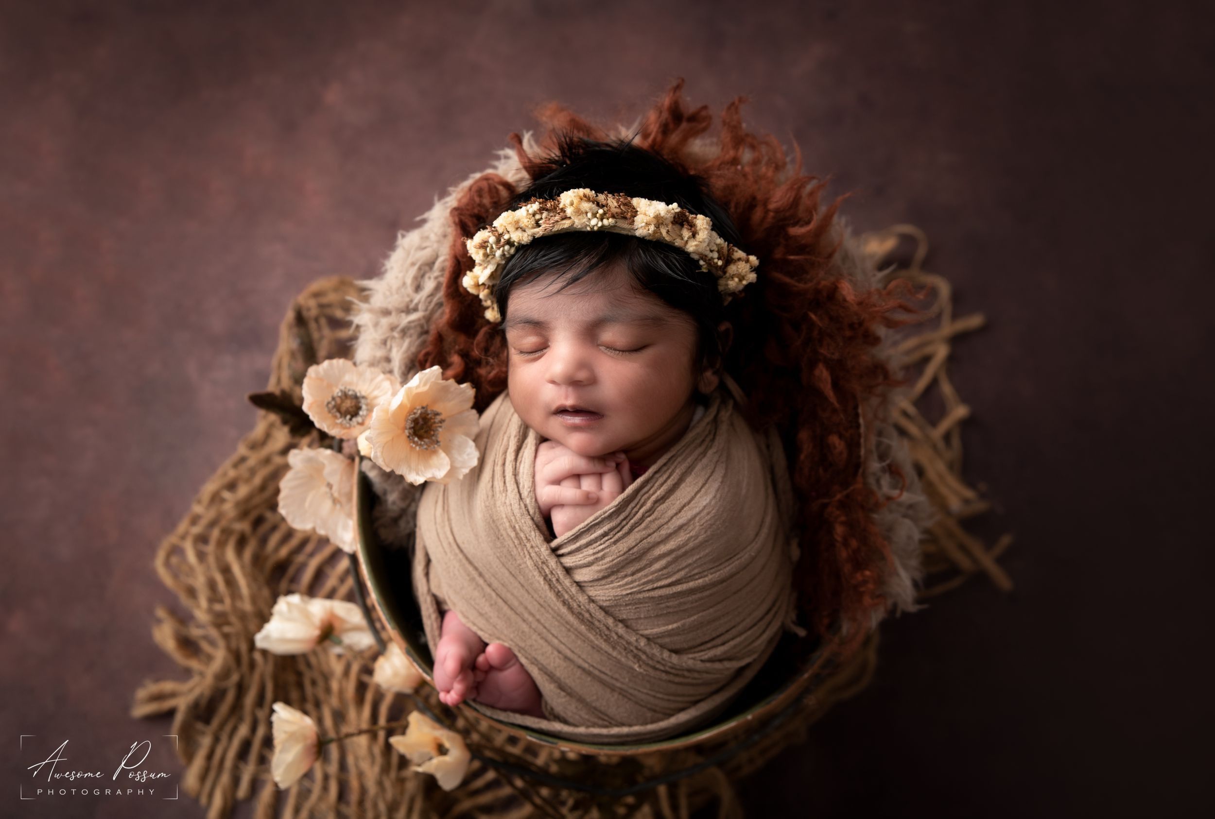 Newborn photography Melbourne, baby in basket with soft props