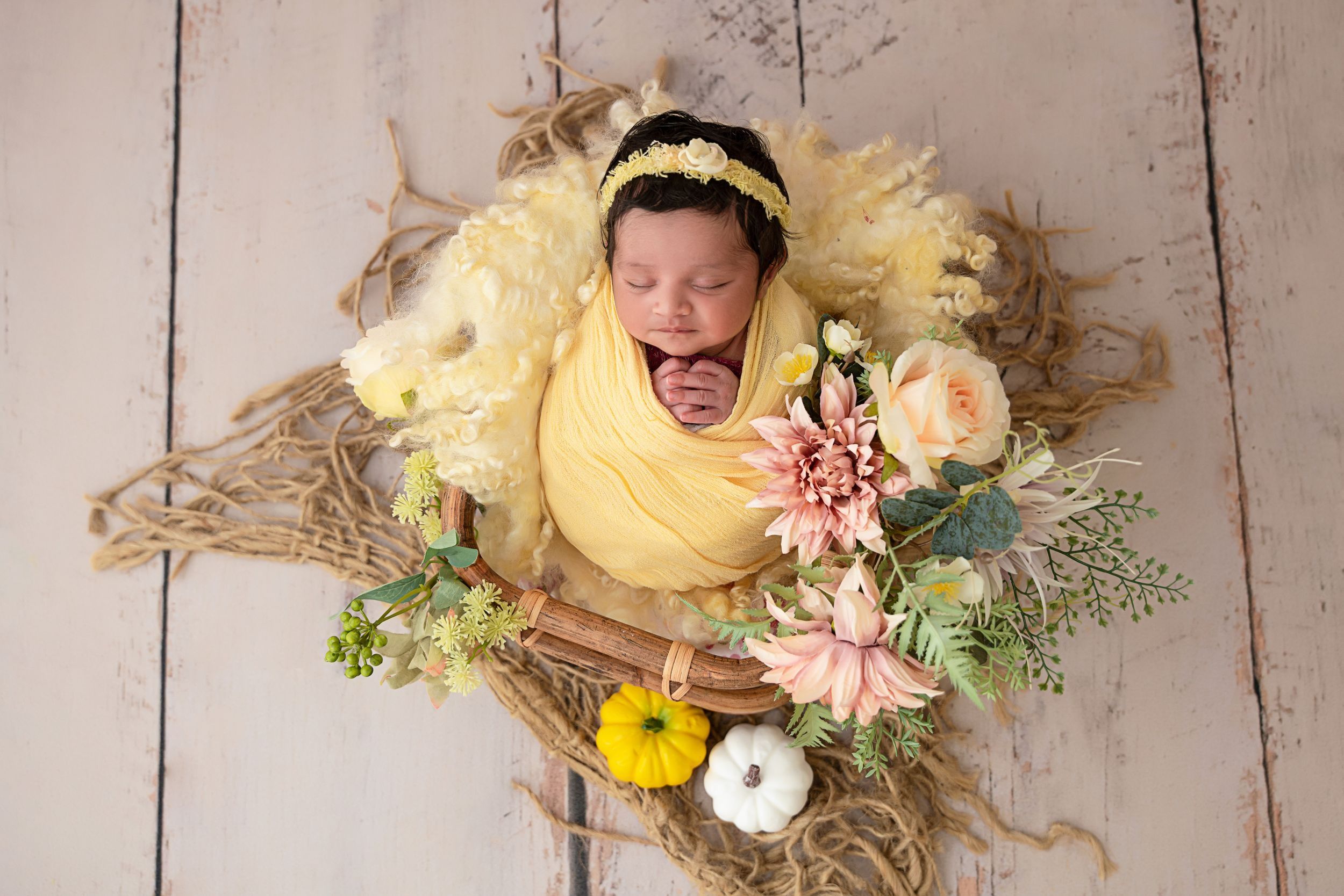 Newborn photography Melbourne, baby surrounded by fresh flowers studio