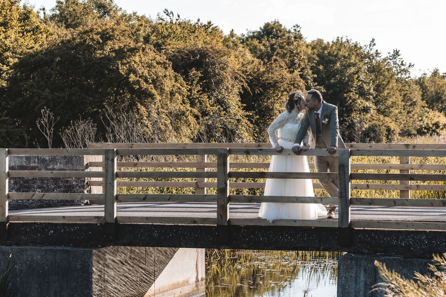Quiet emotional moment between couple during natural wedding day.