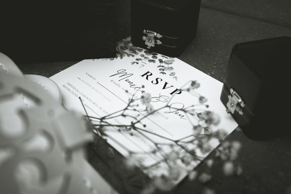 Black and white wedding details showing various photographic shots.