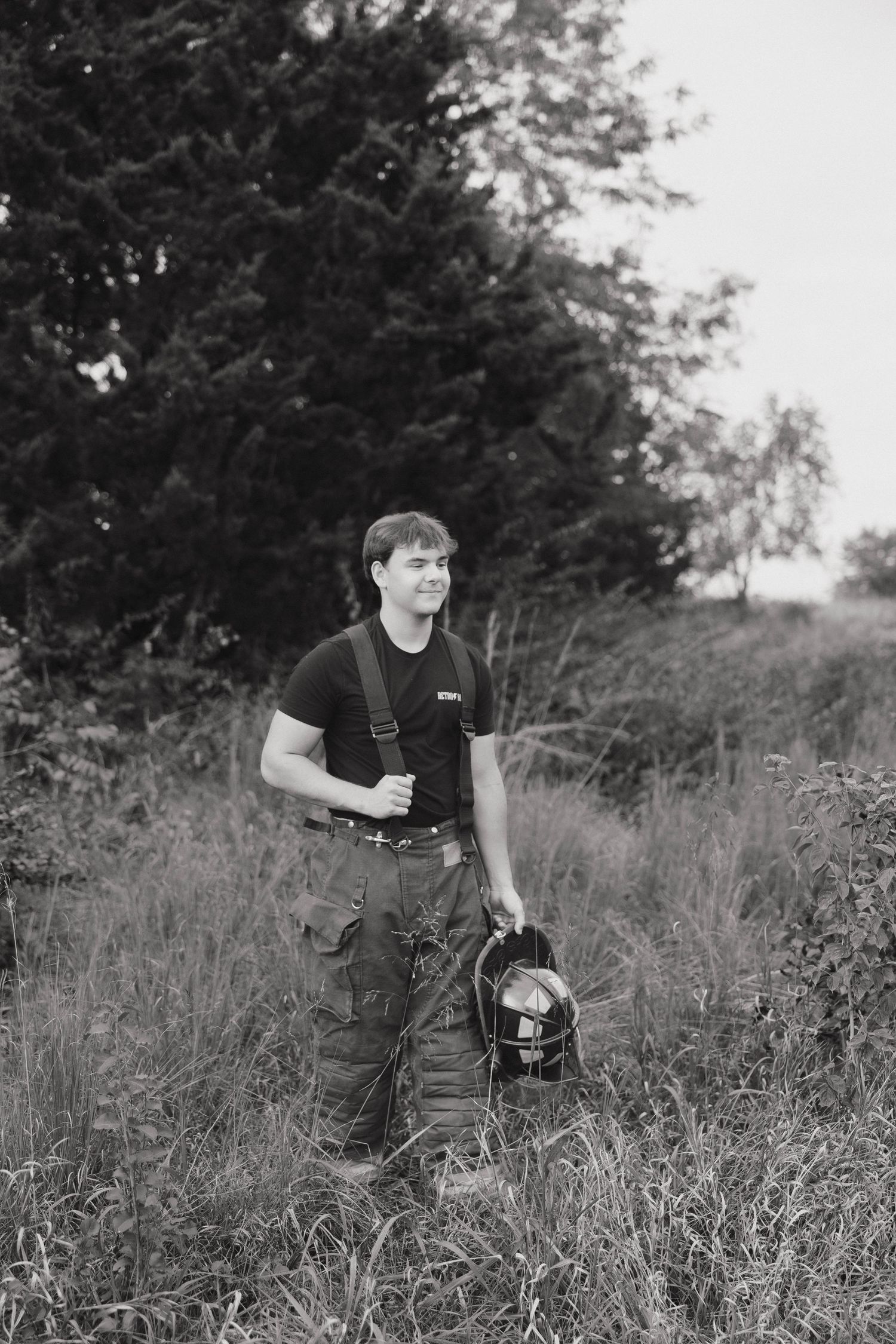 Black and white photo series showing a person walking through tall grass in a natural outdoor setting.