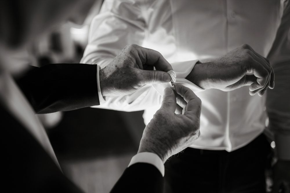 Black and white photos showing hands performing surgical procedures in a medical setting.