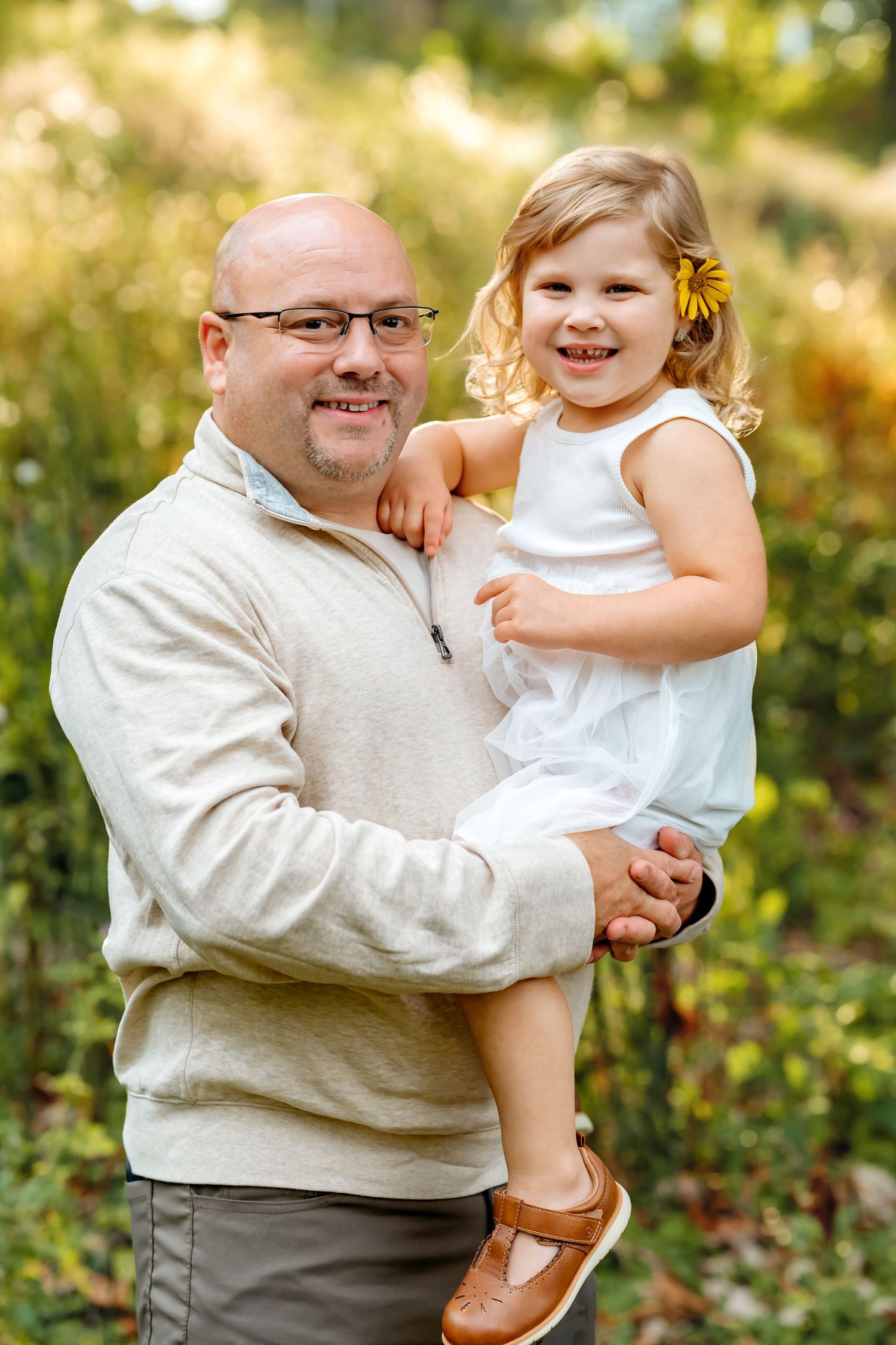 A series of candid moments captured in a natural outdoor setting with warm autumn colors and foliage in the background.