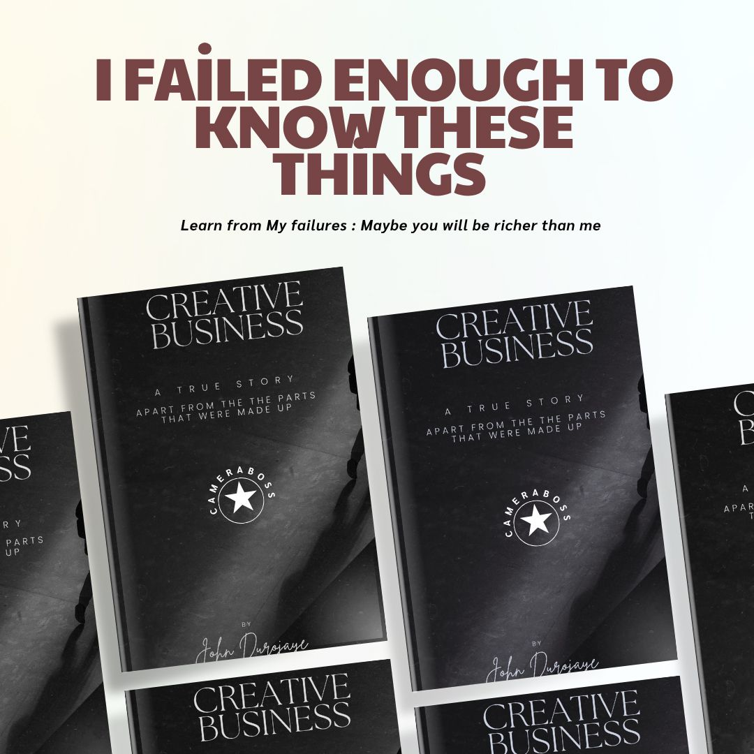 A row of black hardcover books about creative business arranged on a shelf with white text on their spines.
