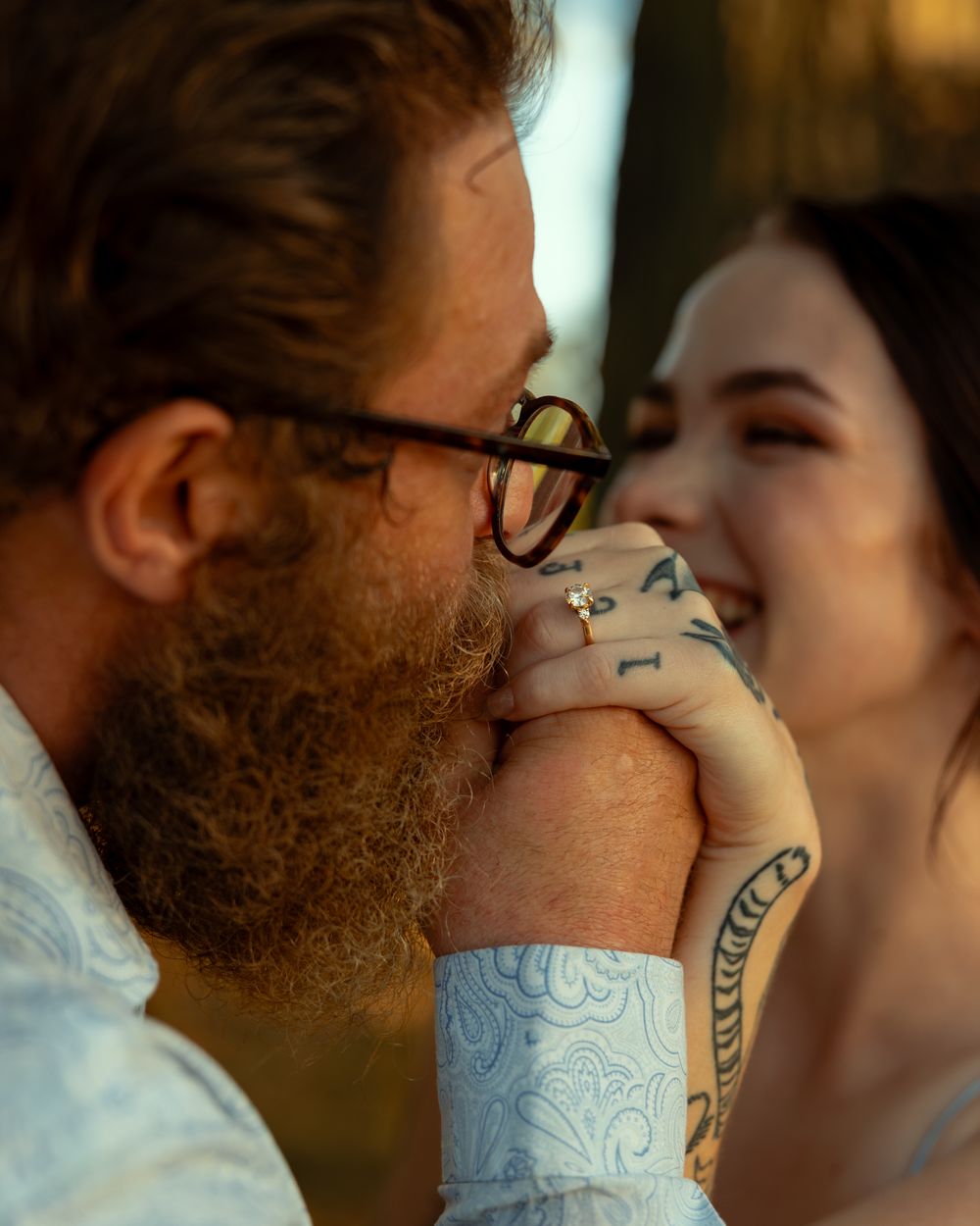 Series of close-up shots showing a couple sharing a romantic moment with a decorative coffee cup between them.