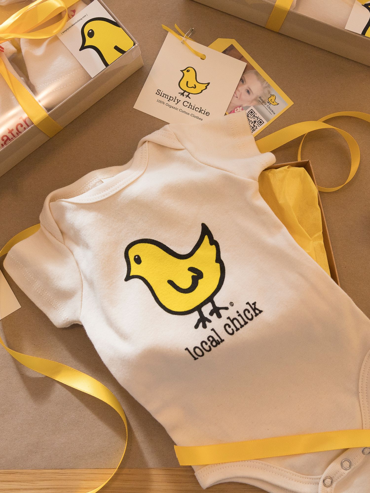 Flatly of a one piece baby clothing for Simply Chickie.