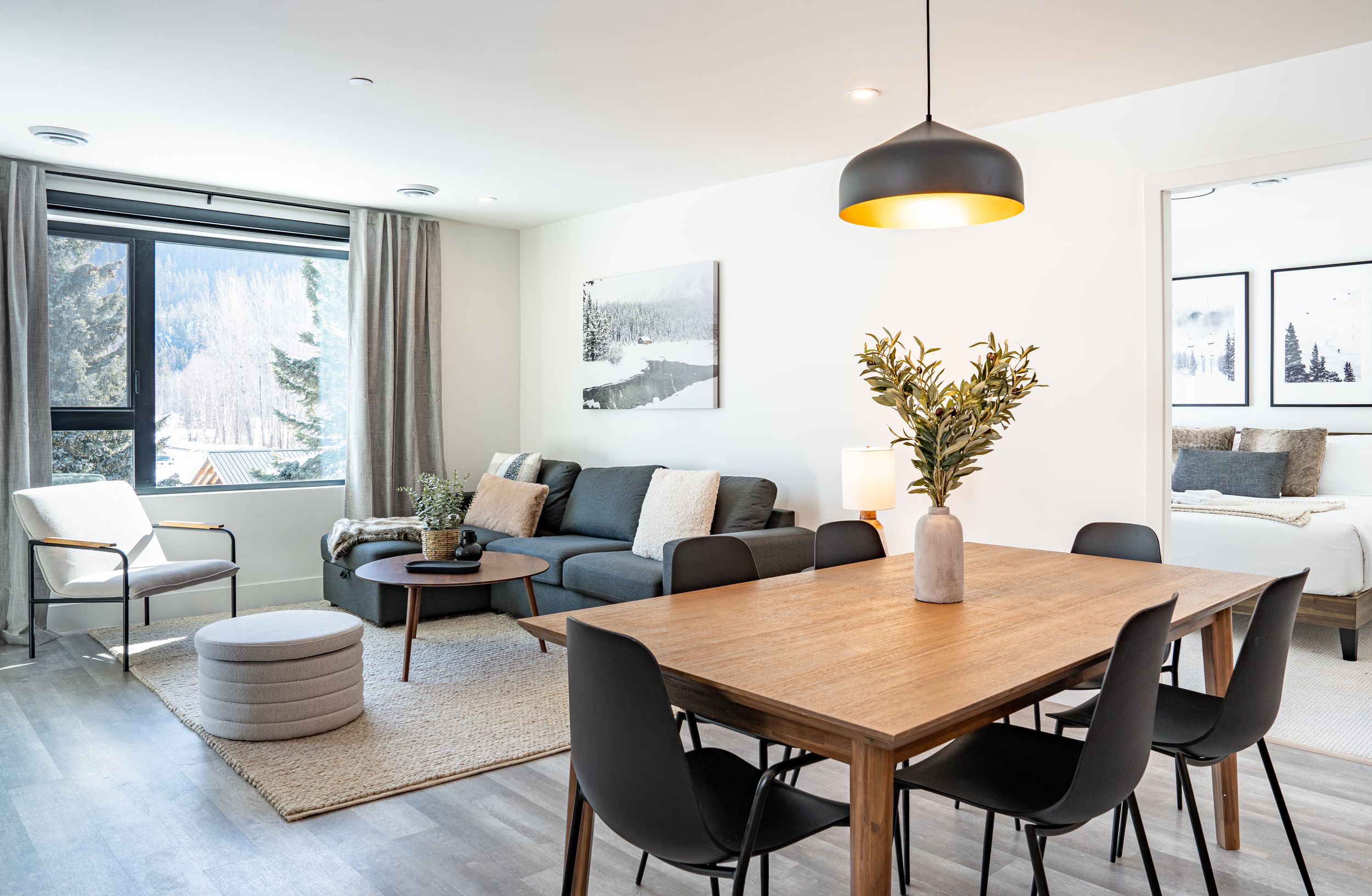 Open concept living and dining area in modern home — professional real estate photography in Revelstoke.
