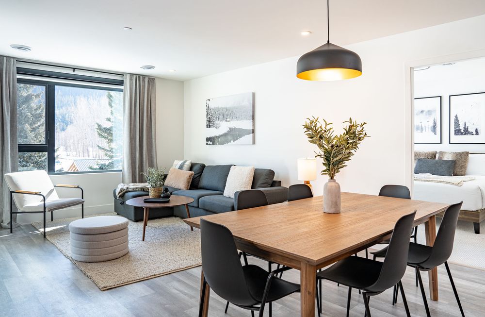 Open concept living and dining area in modern home — professional real estate photography in Revelstoke.
