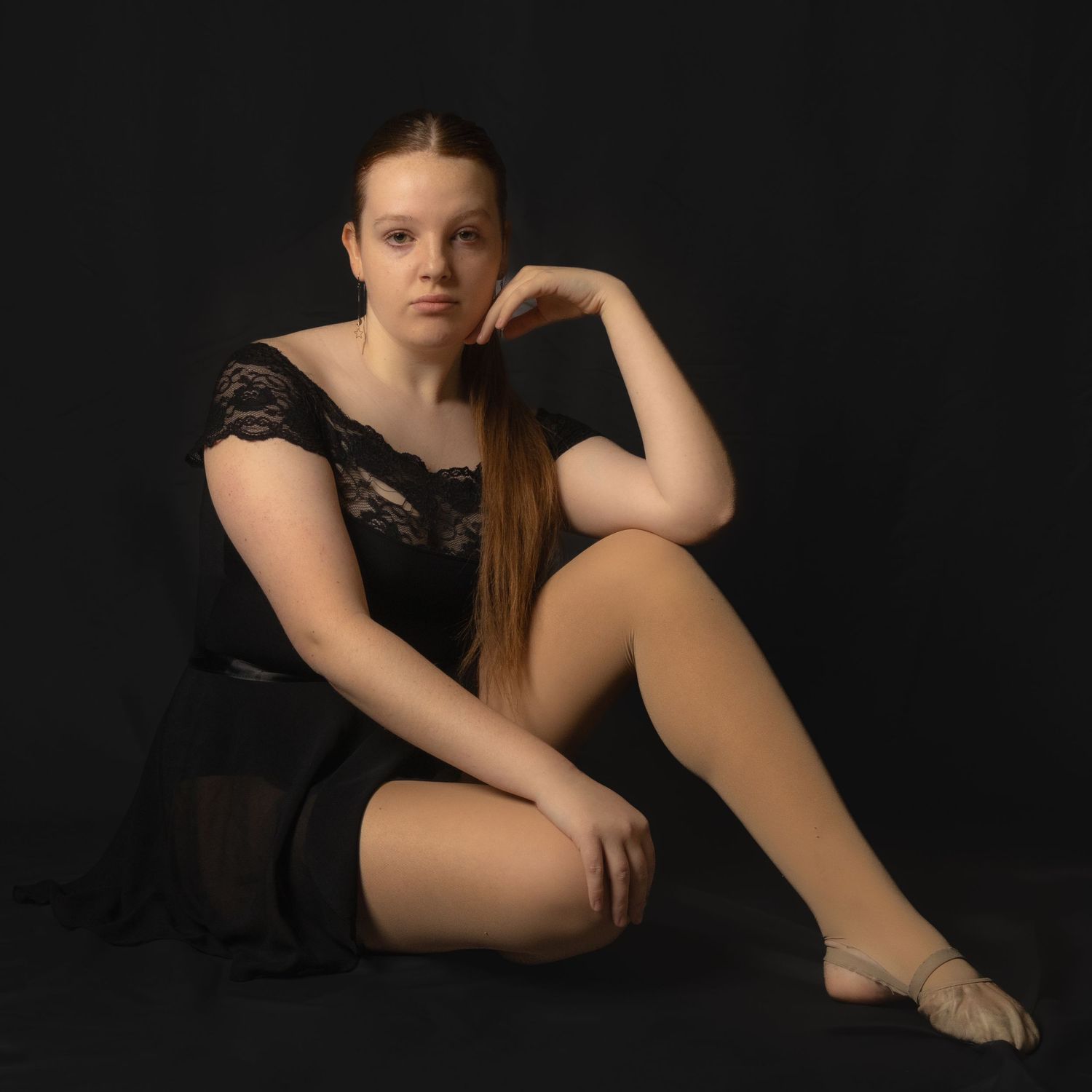 A series of artistic studio portraits featuring graceful poses against a dark dramatic background.