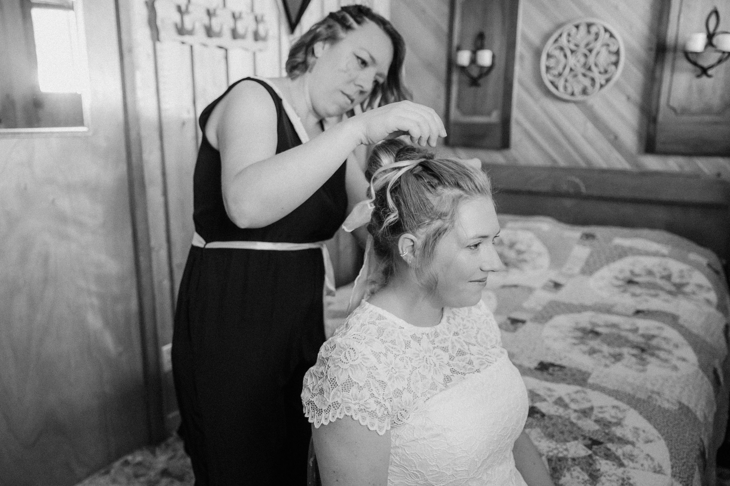 A black and white compilation showing candid moments of wedding preparations and posing with the wedding party.