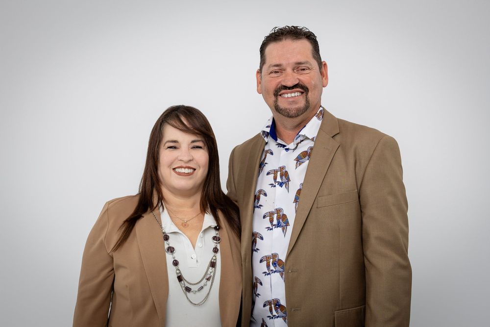 Professional photo series showing couple interacting playfully in brown and white attire.